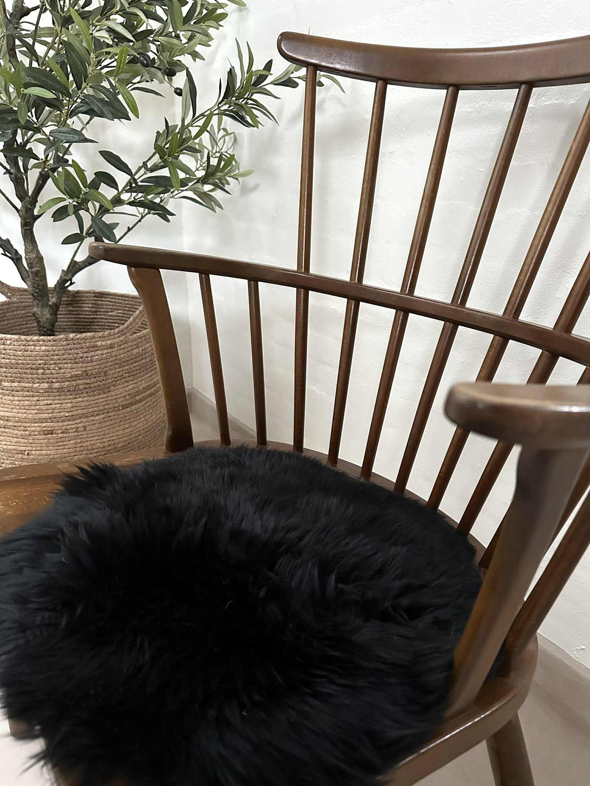 Coussin de siège Ø 34 cm - Peau de mouton noire