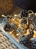 Guirlande lumineuse avec petites pommes de pin
