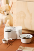 Boîte en forme d’os avec motif chien et gobelet doseur