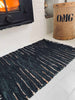 Tapis tressé en cuir – Noir avec rayures effet 70x140