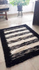 Tapis en peau de mouton cousu à la main - Bord noir - 200x155