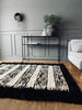 Tapis de sol en peau d’agneau - Tons clairs avec bordure noire